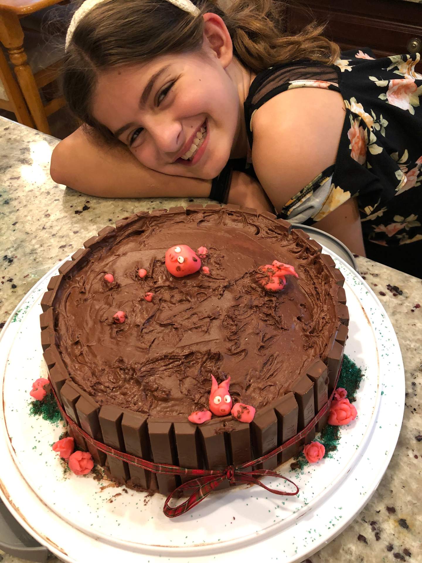 Chocolate piggy mud bath cake, with Kit Kats and fondant piggies.